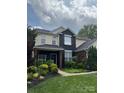 Charming two-story home with manicured lawn and vibrant landscaping, offering inviting curb appeal at 8140 Laurel Run Dr, Charlotte, NC 28269