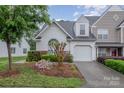 Beautiful single-Gathering home with a one-car garage and landscaped front yard at 942 Pelican Bay Dr, Pineville, NC 28134