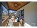 Cozy porch with a seating area and a ceiling fan at 1009 Leigh Ave, Charlotte, NC 28205