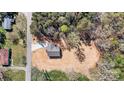 Overhead shot of home on lot with paved driveway and treed surroundings at 102 Kerda St, Taylorsville, NC 28681