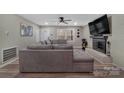 Spacious living room with an electric fireplace and a large sectional sofa at 140 Wandering Ln, Bessemer City, NC 28016