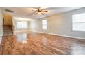 Spacious living room featuring hardwood floors, staircase, neutral paint and plenty of natural light at 1581 Arborgate Dr, Rock Hill, SC 29732