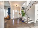 Inviting foyer with hardwood floors, a staircase, and a view of the living space at 2329 Paddlers Cove Dr, Clover, SC 29710