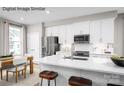 Modern eat-in kitchen features stainless steel appliances, white cabinets and expansive island with barstool seating at 2532 Ellen Ave # 1001F, Charlotte, NC 28208