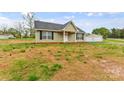 Charming single-story home with a classic design, well-maintained exterior, and a detached garage at 391 Springs East Rd, Lincolnton, NC 28092