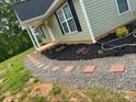 Landscaped front yard features a stone walkway leading to the charming home's entrance at 391 Springs East Rd, Lincolnton, NC 28092