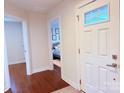 Bright hallway with wood floors, leading to a bedroom at 531 Cherry Blossom Nw Ave, Concord, NC 28027