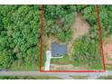 Aerial view of a wooded property featuring a modern home with a well-maintained lawn and long driveway at 8225 Long Island Rd, Catawba, NC 28609