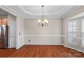 Open dining room with hardwood floors, elegant trim and neutral color palette at 831 Daly Cir, Fort Mill, SC 29715