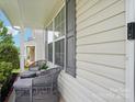 Cozy front porch with seating area, perfect for relaxing and enjoying the neighborhood views at 9612 Eagle Feathers Dr, Charlotte, NC 28214