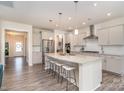 Spacious kitchen with large island, stainless steel appliances, and modern pendant lighting at 1003 Dorsey Dr, Fort Mill, SC 29715