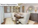 Formal dining room with a large table, elegant chairs, and stylish decor at 120 Autumnwood Rd, Troutman, NC 28166