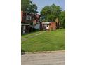 Single level brick unit with awnings and a grassy front yard at 1205 W Bank St, Salisbury, NC 28144