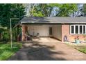 Attached carport featuring brick accents and ample space for parking and storage at 1218 Donna Dr, Shelby, NC 28152