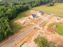 Scenic aerial view of a developing neighborhood, highlighting homesites and verdant trees at 1504 Baileys Run, Gastonia, NC 28056