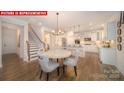 Spacious kitchen with white cabinets, stainless steel appliances, and a center island at 156 Asmodean Ln, Troutman, NC 28166