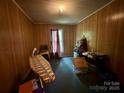A room with wood paneling and ample space for storage at 267 Hall Nw Ave, Concord, NC 28027