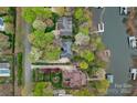 Aerial shot showcasing waterfront homes, private docks, and lush greenery surrounding a serene lake at 276 Greyfriars Rd, Mooresville, NC 28117