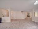 Spacious living area with neutral paint, modern floors, and an open layout, perfect for entertaining at 3227 Deshler Morris Ln, Charlotte, NC 28216