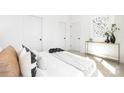 Bright bedroom with white walls, cozy bedding, and modern décor at 327 Lincoln Sw St, Concord, NC 28025