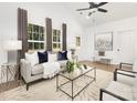 Bright living room with vaulted ceilings, large windows, and modern furniture at 327 Lincoln Sw St, Concord, NC 28025