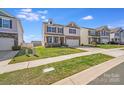 Inviting two-story home with a two-car garage, covered porch, and landscaped front yard in a suburban setting at 3286 Shining Rock Sw St, Concord, NC 28027