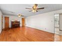 An inviting open floor plan with hardwood floors offers versatile living space and views into the eat-in kitchen at 3320 28Th Ne St, Hickory, NC 28601