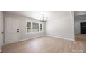 Open-concept living room features modern light fixtures and updated finishes at 3715 Dallas High Shoals Hwy, Dallas, NC 28034