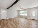 Bright living room with new laminate flooring, beam accent, neutral paint, and updated ceiling fan at 4303 Greenhaven Ln, Gastonia, NC 28056