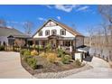 Charming exterior view of a home with a well-manicured front yard and inviting porch at 5888 Wood Duck Way, Catawba, NC 28609