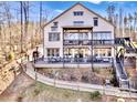 Expansive two-story home with large decks, outdoor seating, and a beautifully landscaped yard at 5888 Wood Duck Way, Catawba, NC 28609