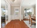 Elegant foyer with hardwood floors, white trim, and natural light at 9636 Cotton Stand Rd, Charlotte, NC 28277