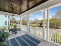 Spacious porch with white columns and furniture, offering a relaxing outdoor space at 9636 Cotton Stand Rd, Charlotte, NC 28277