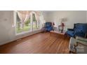 Bright living room featuring hardwood floors, large window and elegant drapes at 101 Stoneybrook Dr, York, SC 29745