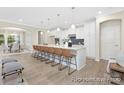 Open-concept kitchen with a large island, perfect for entertaining, adjacent to the dining area at 1303 Links Crossing Dr # 219, Monroe, NC 28112