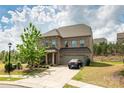 Beautiful two-story brick home with a driveway, two-car garage, and lush landscaping at 17712 Yarwill Ct, Charlotte, NC 28278
