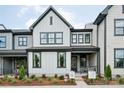 Charming two-story home with modern farmhouse-style exterior, featuring a welcoming front porch at 217 Halemarg Dr, Belmont, NC 28012
