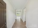 Inviting home hallway with wood flooring and ample natural light leading into the main living areas at 2229 Camber Dr # Cwo0100, Gastonia, NC 28054