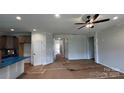 Unfinished living room with fresh drywall, bright windows, and modern ceiling fan awaiting personalized finishing touches at 2229 Camber Dr # Cwo0100, Gastonia, NC 28054
