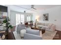 Bright living room with a ceiling fan and hardwood flooring at 300 W 5Th St # 136, Charlotte, NC 28202