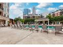 Relaxing pool area with lounge chairs and city views, perfect for enjoying sunny days at 300 W 5Th St # 136, Charlotte, NC 28202