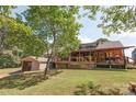 Expansive backyard with deck, screened porch and shed, perfect for outdoor entertaining at 3014 Haigler Rd, Monroe, NC 28110