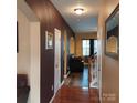 View of the home's entry hallway with an arched entryway and wood floors at 464 Laurel Fork Dr, Fort Mill, SC 29715