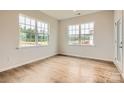 Home office featuring natural light, wood flooring, and neutral paint color scheme at 8442 Norman Forest Rd, Lancaster, SC 29720
