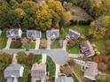 Neighborhood aerial shot showcases mature trees, manicured lawns, and cul-de-sac street at 8929 Lizzie Ln, Huntersville, NC 28078
