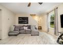Comfortable living room with cozy seating, large window, and stylish tile flooring at 1213 Salvadore Ct, Gastonia, NC 28052