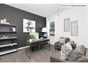 Stylish home office space with a large window, modern desk, and comfortable seating area at 1324 Secrest Commons Dr, Monroe, NC 28112