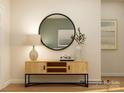 Bright entryway featuring wood floors, decorative mirror, console table, table lamp, and artistic decor at 1552 Croydon St, Indian Land, SC 29707