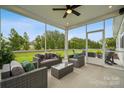 Screened patio with outdoor seating and a view of the landscaped backyard at 2037 Mantle Ridge Dr, Indian Trail, NC 28079