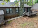 Spacious backyard with a deck and stone chimney, ready for peaceful outdoor living at 380 Sweetgum Dr, Fort Mill, SC 29715